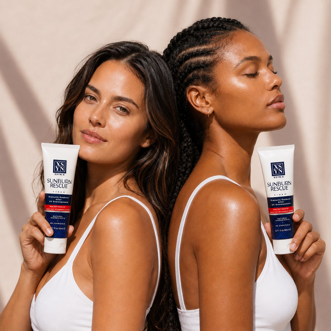 Two women holding XSYN-4 tubes